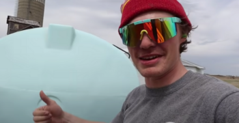 Cole the Cornstar wearing sunglasses and holding up a thumbs up