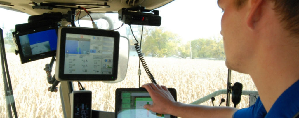 Photo inside a tractor cab of yield monitor