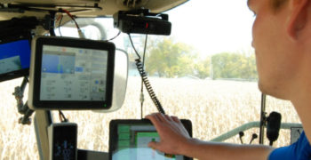Photo inside a tractor cab of yield monitor