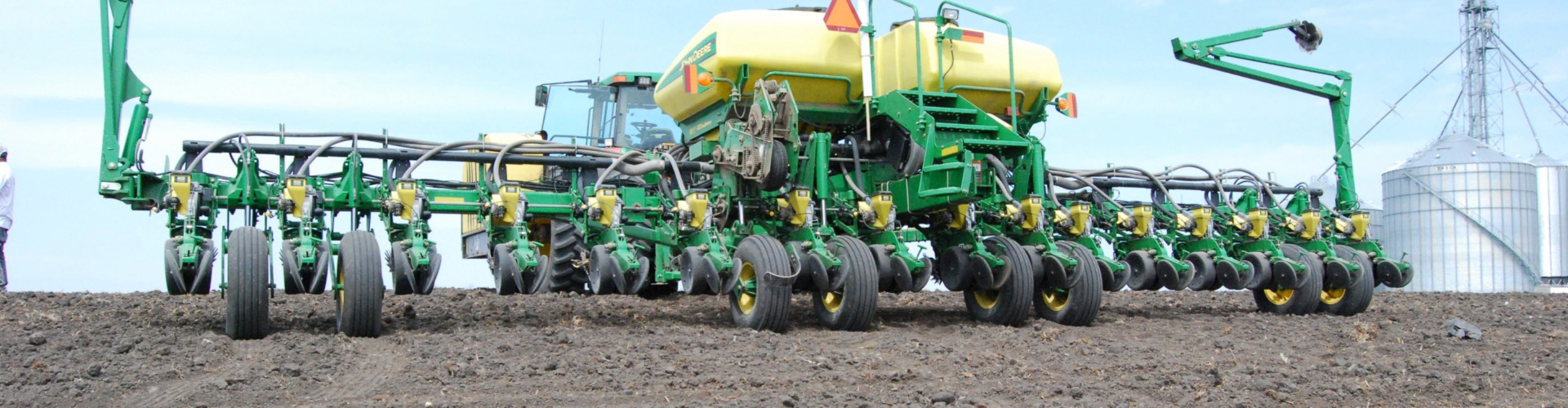 Planter driving across field