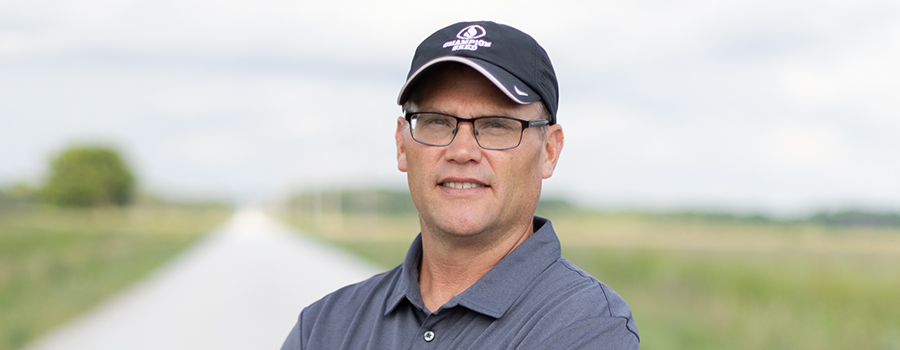 Headshot of Jay Solum wearing a Champion Seed ball cap